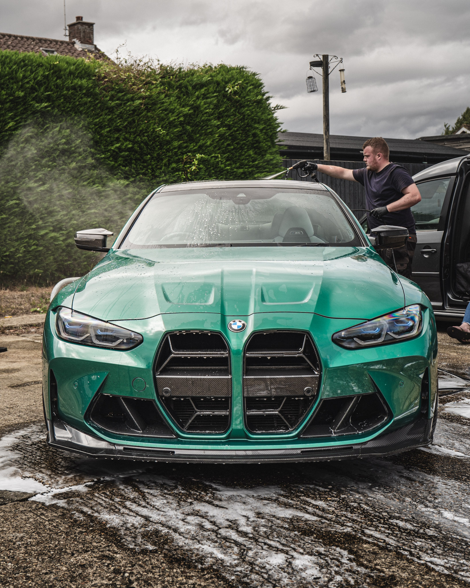 Audi RS6 under canopy being detailed